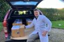 WPC team member David Carruth with the pork boxes that are posted out fresh the day it is butchered