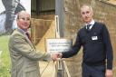 Graeme Cock of Mole Valley and John Fergusson with the plaque to commemorate the opening of the new mill