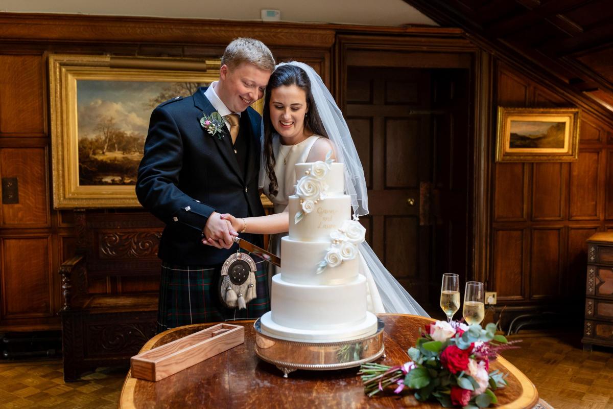 Laura and Gavin cutting the Cake at Dundas Castle (Image: Imagine Images)