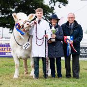 John Dykes, pictured with his wife Kate, at one of the couple's most recent judging roles – selecting the champion young handler at the Royal Highland Show Ref:RH250623161  Rob Haining / The Scottish Farmer