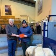 William Brown pictured with judge Michael Wilson (right) and the champion Texel crosses