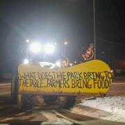 One of the signs on a tractor at the protest