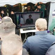 Farmers watch as French prime minister Gabriel Attal announces new measures