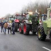 Farmers prepare to lift a blockade in Les Ulis, south of Paris