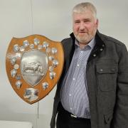 Junior vice-president Brian Ross with the new trophy to be presented to the best natives in the breeding sheep section