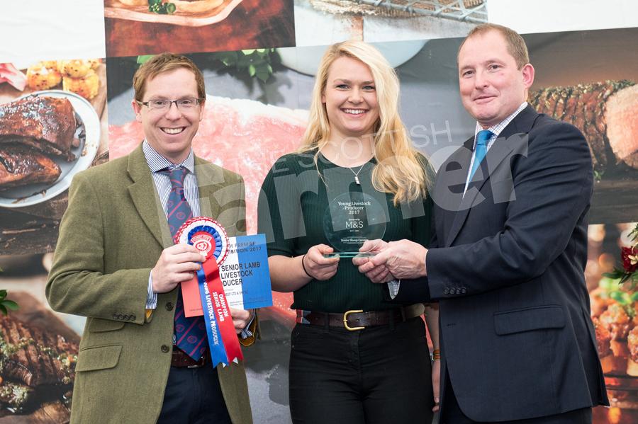 Robert Rennie won the YLP senior lamb champion,  Tom Slay and Steve Mclean from Marks and Spencer, Rebecca Oldham receives  the trophy on Roberts Behave. Ref: RH1811170278.