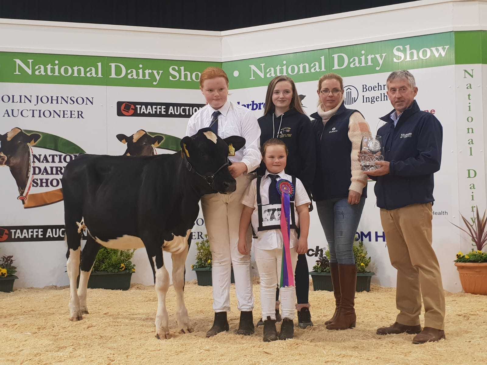 Winning calf Rathard Alana pictured with Paula Hynes, daughters Chloe, Becky and Georgina and Pat O Connor of Dovea Genetics 