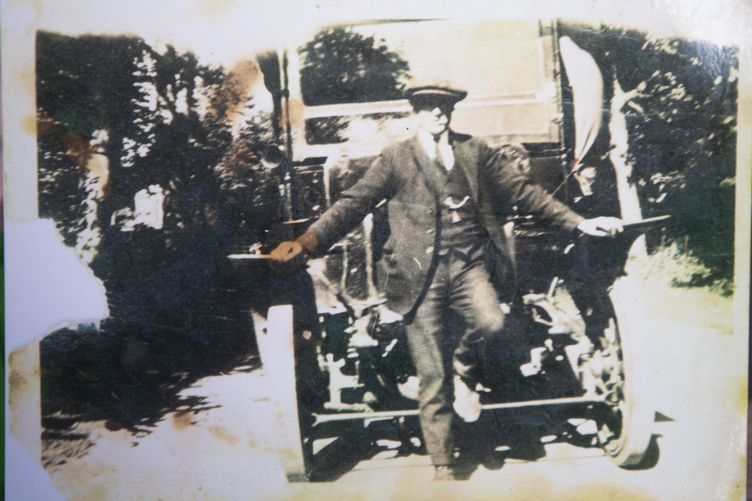 the late Fred Davidson posing in front of the solid wheeled 16 hp Albion bus in 1921 Ref:RH300121277 Rob Haining / The Scottish Farmer...