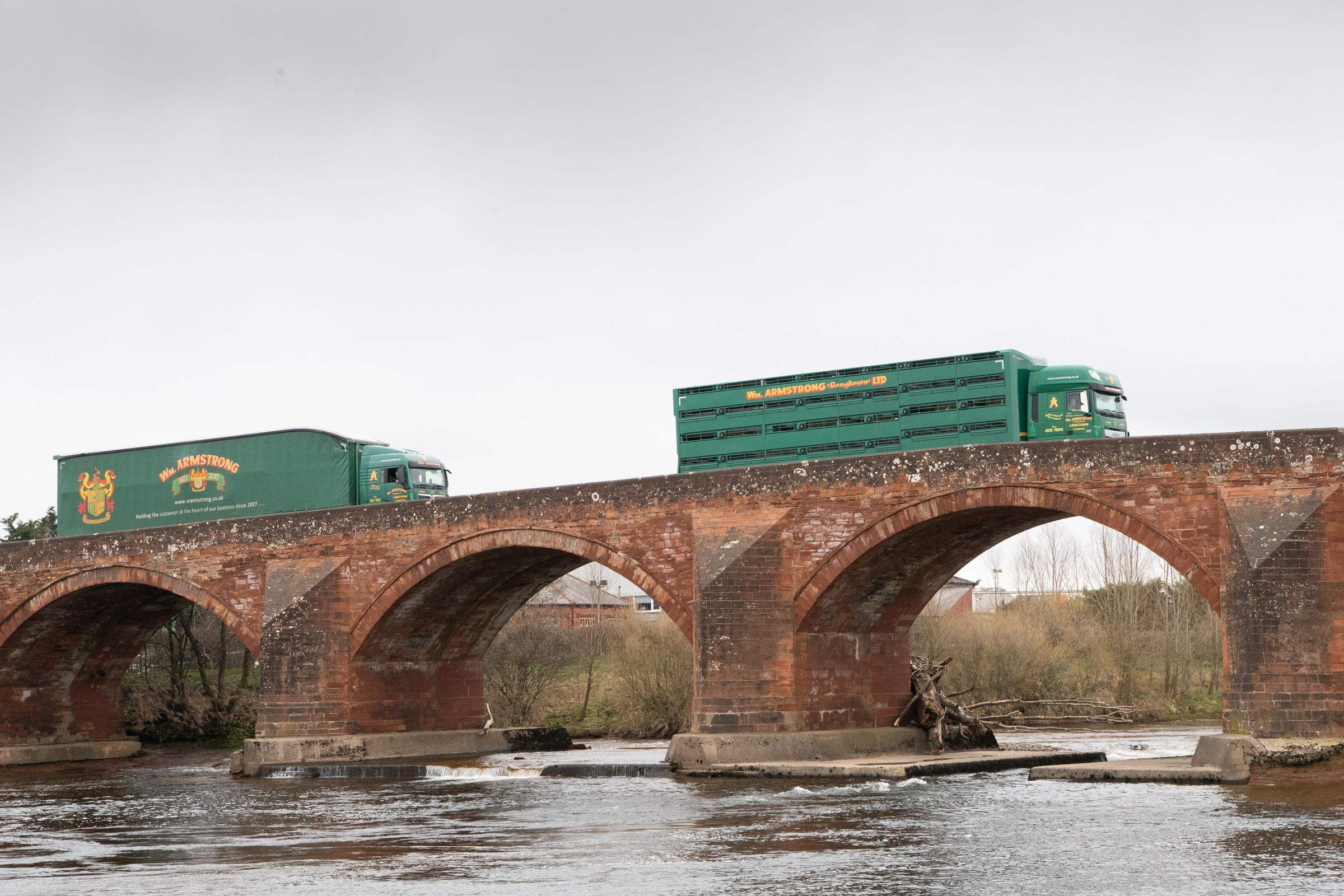 on to the next job two of the Armstrong lorries head over the Longtown Bridge which spans the river Esk Ref:RH200321127 Rob Haining / The Scottish Farmer...