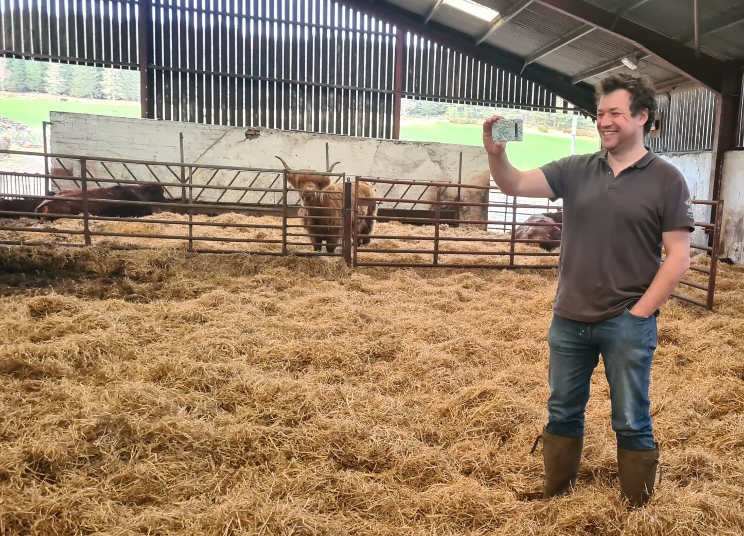 Farmer Jock taking his London pupils inside the cattle sheds to learn about calving