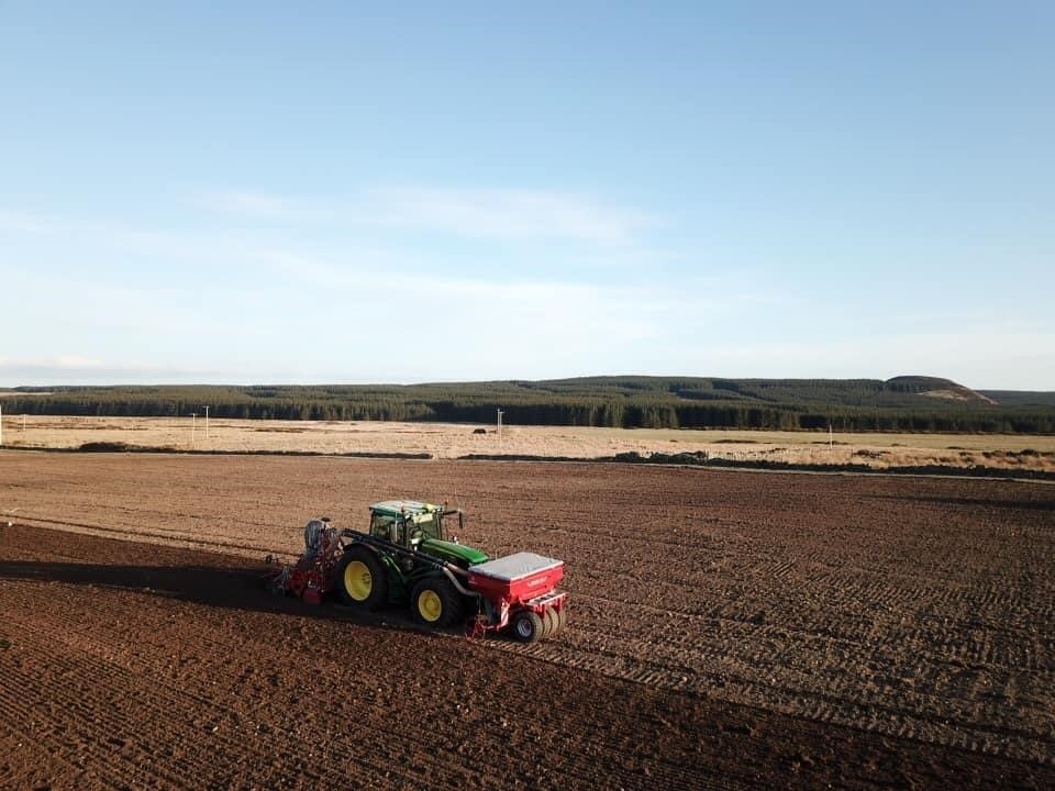 Neil sowing spring barley near Reay, Caithness