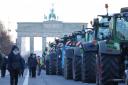Protesting German farmers disrupt traffic with tractors over diesel tax changes.