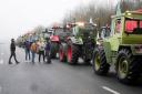 Farmers prepare to lift a blockade in Les Ulis, south of Paris