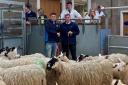 Champion pen from A McKenzie and partners, Ardgate, sold for £185 per life pictured left with Jamie Pirie and judge, Douglas Adam, Muirdean