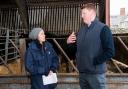John Elliot Jr discusses on-farm emission reduction strategies with Mairi Gougeon at Roxburgh Mains. Ref:RH090124111  Rob Haining / The Scottish Farmer