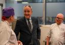 Richard Lochhead MSP and national chef Gary Maclean speak to a student at the launch