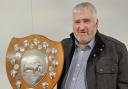 Junior vice-president Brian Ross with the new trophy to be presented to the best natives in the breeding sheep section