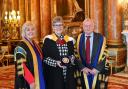 Linda Hanna, Anne Seaton and Wayne Powell with the Queen's Anniversary Prize medal
