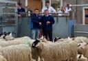 Champion pen from A McKenzie and partners, Ardgate, sold for £185 per life pictured left with Jamie Pirie and judge, Douglas Adam, Muirdean