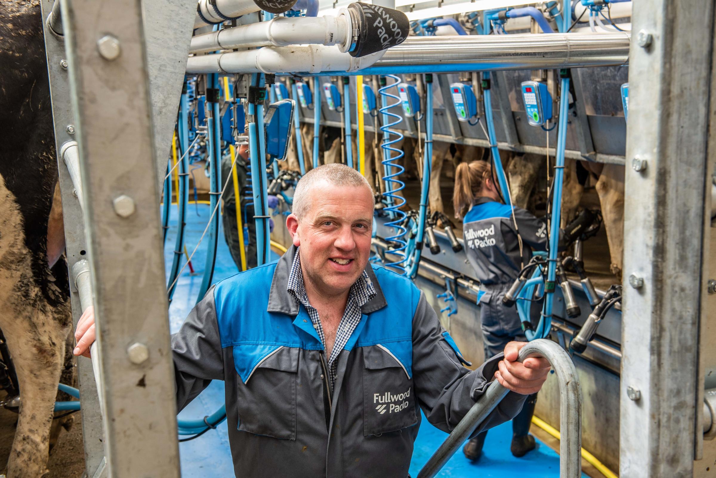 In the new parlour, David gets ready for another milking and either himself or Andrea are there at all milkings