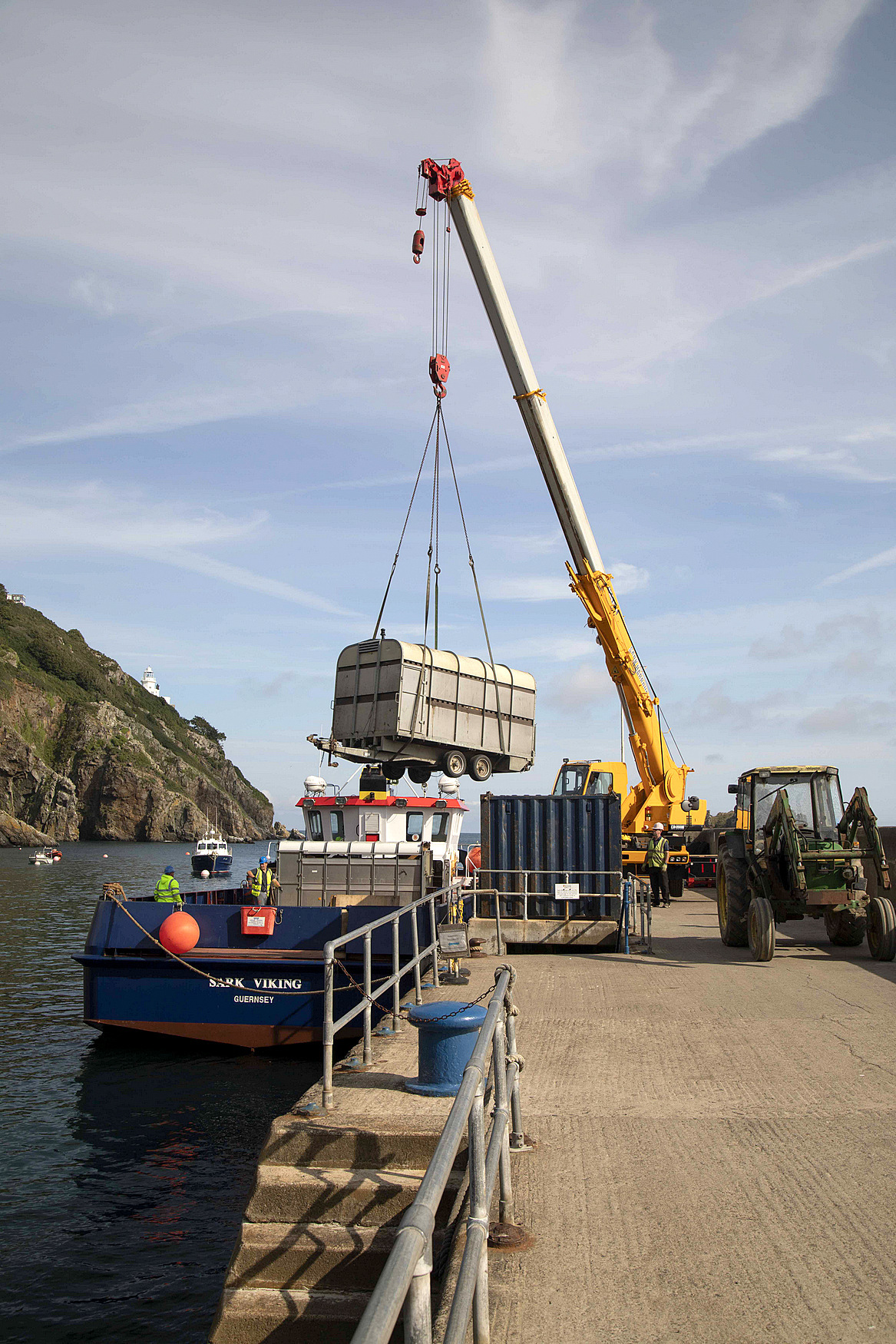 The cows are unloaded at the Sark Island port off the boat from Guernsey
