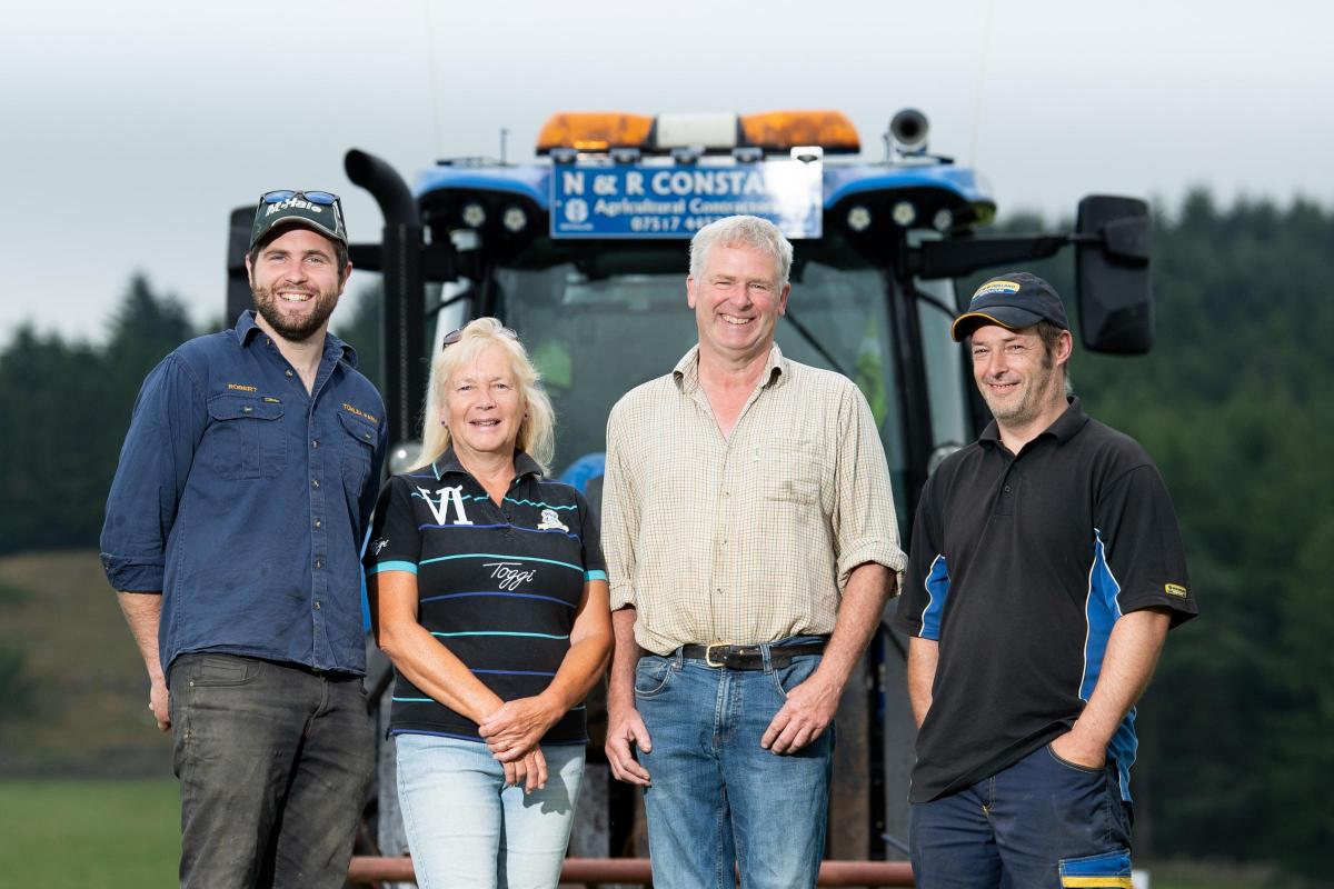 Robert, Alison, and Neil Constable with tractor man Duncan Godfrey  Ref:RH270721070  Rob Haining / The Scottish Farmer