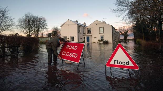 The Scottish Farmer: Homes at risk of flooding are urged to follow advice from the Environment Agency. (PA)