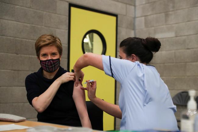 First Minister Nicola Sturgeon receives her booster jab of the coronavirus vaccine in Glasgow