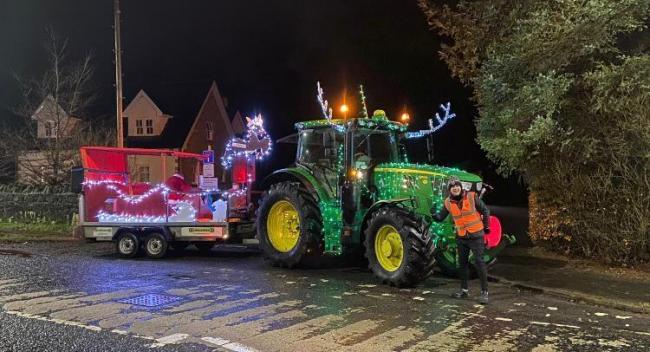 THIS TRACTOR certainly spread plenty of Christmas cheer at the weekend for Eaglesham Fair's Santa Run. Robbie Baird of Floors Farm had the joy of driving the lit-up machine around Eaglesham, raising a phenomenal £3650 for food parcels for