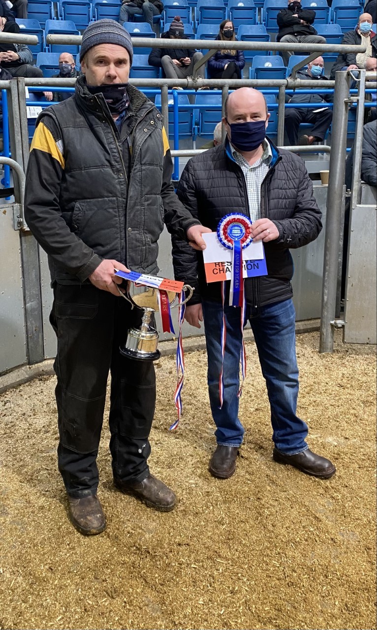 Andrew Anderson left, won both the champion and the reserve honours with Limousin cross heifers at the store cattle show sponsored by Eric Thomson of Thomson of Sauchen Transport, right 