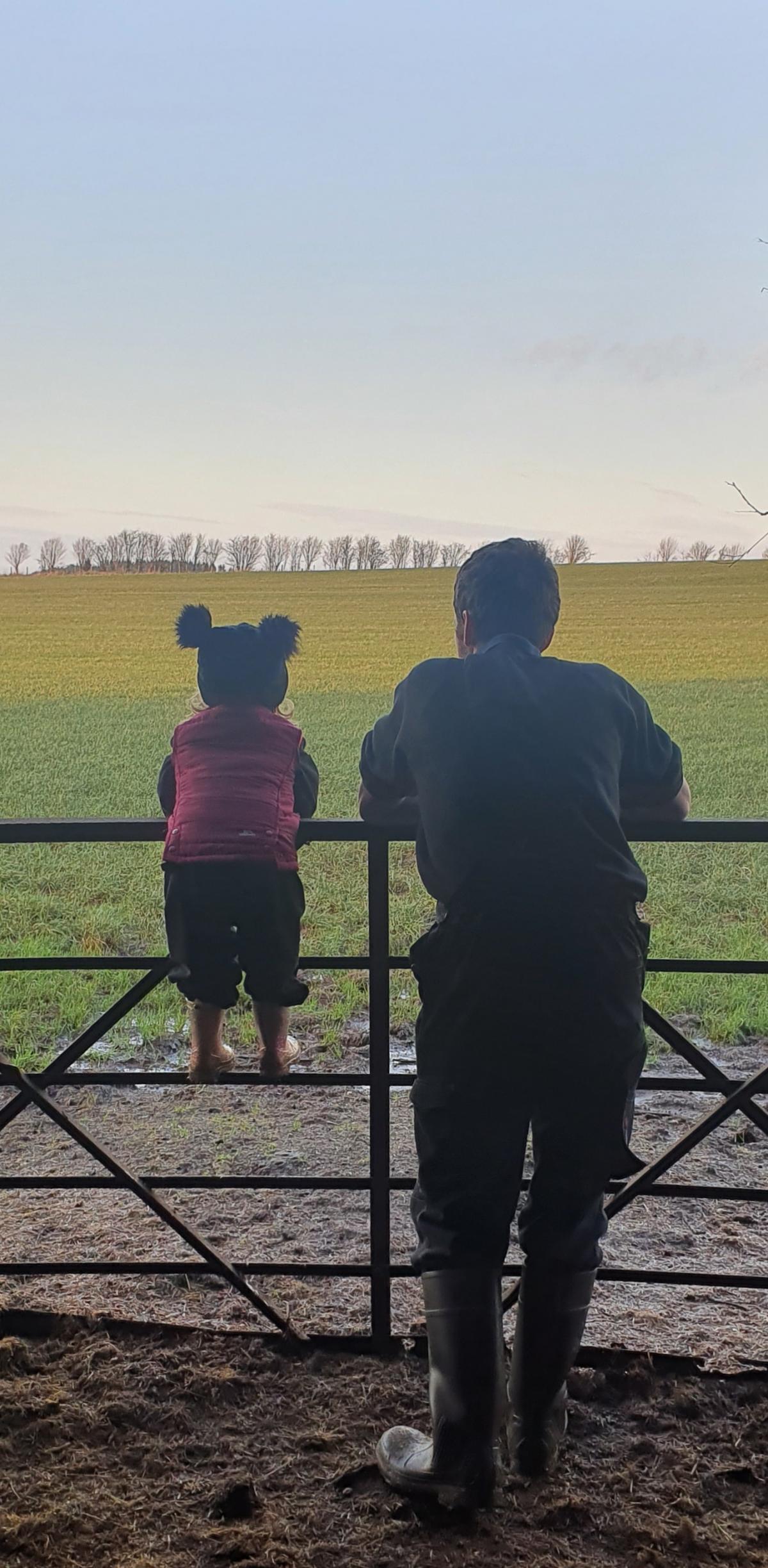Jenna Carmichael - My husband Sam Carmichael & daughter Esther Carmichael enjoying the view after feeding some of our cattle
