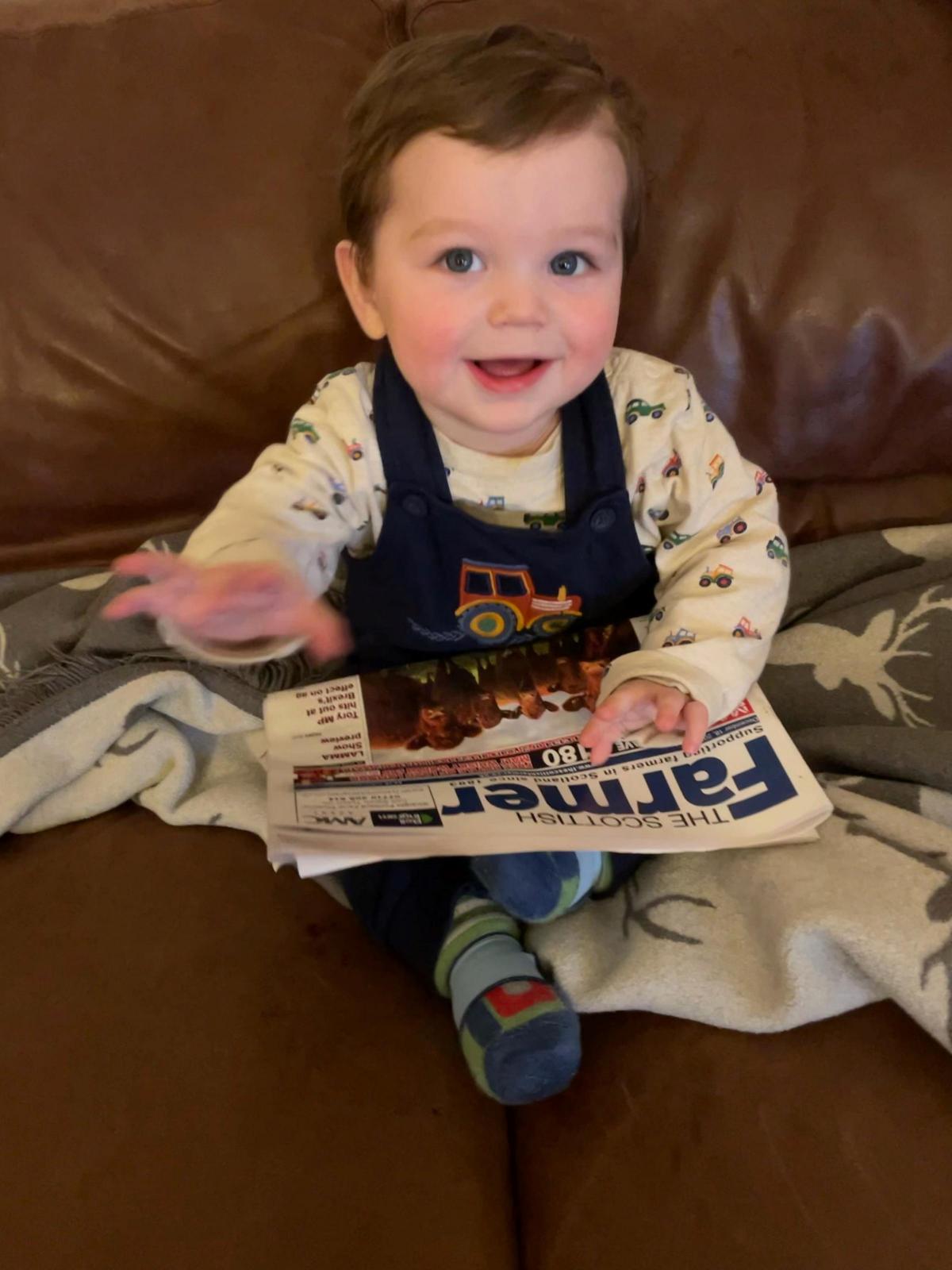 Lynn Greig - Cole chuffed to get a hold of Dads paper.