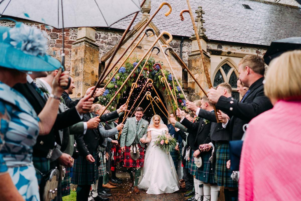 Married recently were James Simpson, Hillridge Farm, Biggar, and Emily Steele, of Monksfoot Farm, Douglas. They tied the knot in Biggar Kirk then on to a marquee at Monksfoot for the celebration – as you can see, they had to run a gauntlet of crooks aft