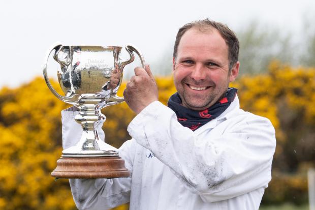 James Nisbet with the Overall cattle champion trophy  Ref:RH300422029  Rob Haining / The Scottish Farmer...