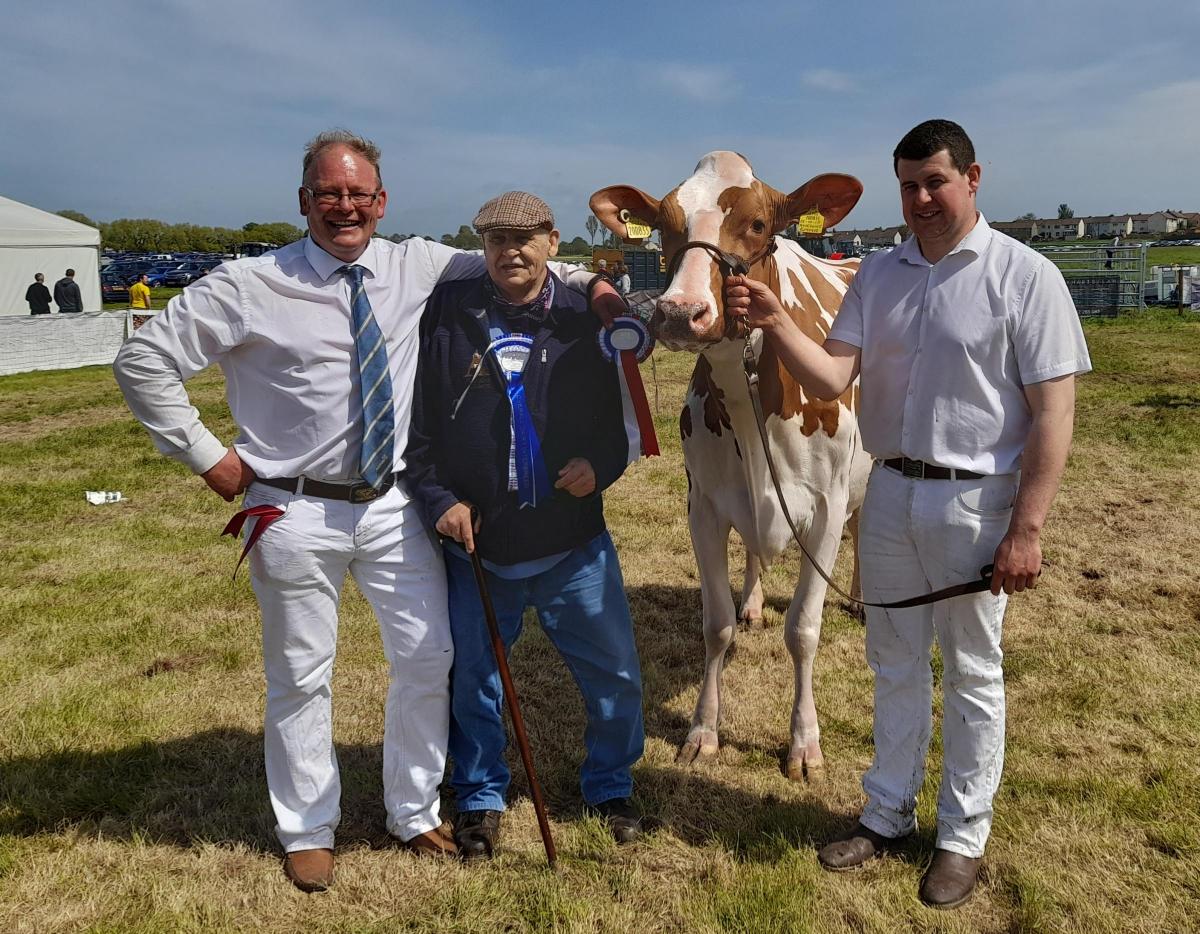 Ayr Show Red and white champion and reserve overall dairy photographed from left with breeder, Robbie Scott and joint owners Salvador Esquierdo and Andrew Struthers