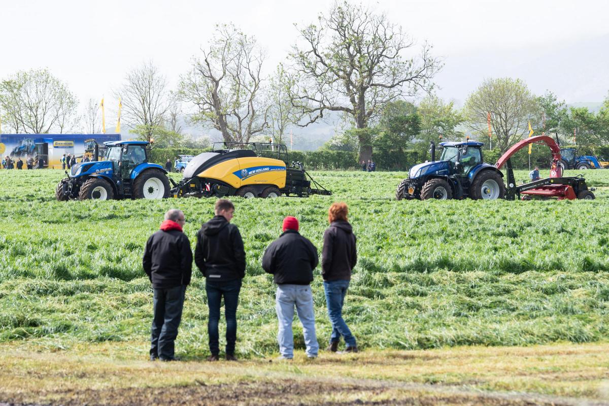 Looking over the New Holland plot, two T7 tractors one with the BigBaler 890 Plus and the other with the trailed Kongskilde fct 1260 forage harvester are being displayed    Ref:RH180522197  Rob Haining / The Scottish Farmer...