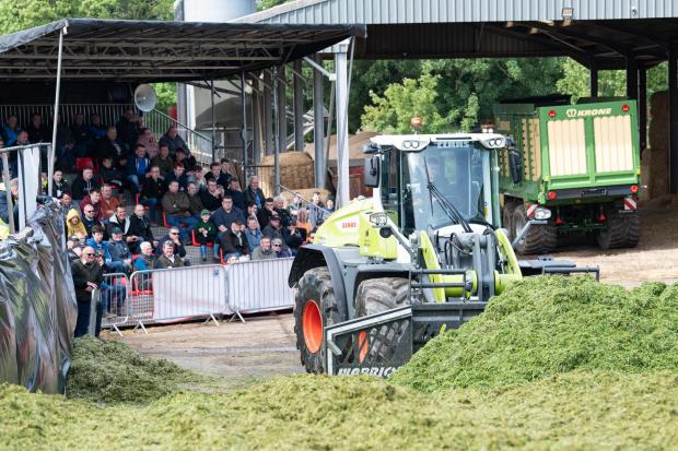 The Scottish Farmer: Put through its paces in front of a crowd was the Claas Torion 1511 available in 4 and 6-cylinder engines variants and mounted on the front was the MDE warrior buckrake Ref:RH180522246 Rob Haining / The Scottish Farmer...