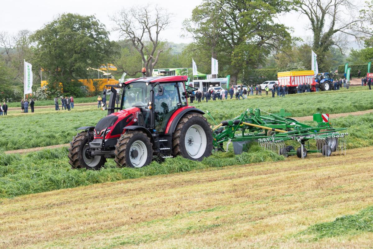 Valtra tractor and McHale R 62-72 Centre Delivery Rake, the rake is designed to be gentle on the crop, delivering the perfect swath preparation Ref:RH180522227  Rob Haining / The Scottish Farmer...