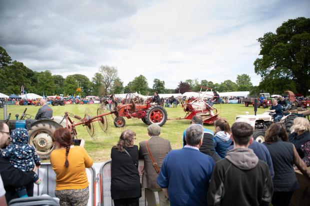 The Scottish Farmer: Spectators gather round the main ring at Fife show for the display of vintage horse drawn equipment and tractors Ref:RH210522374 Rob Haining / The Scottish Farmer...