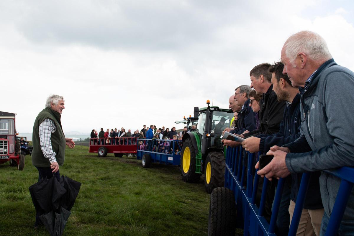 David Orr give a bit of information to visitors out on the farm tour  Ref:RH010622122  Rob Haining / The Scottish Farmer...