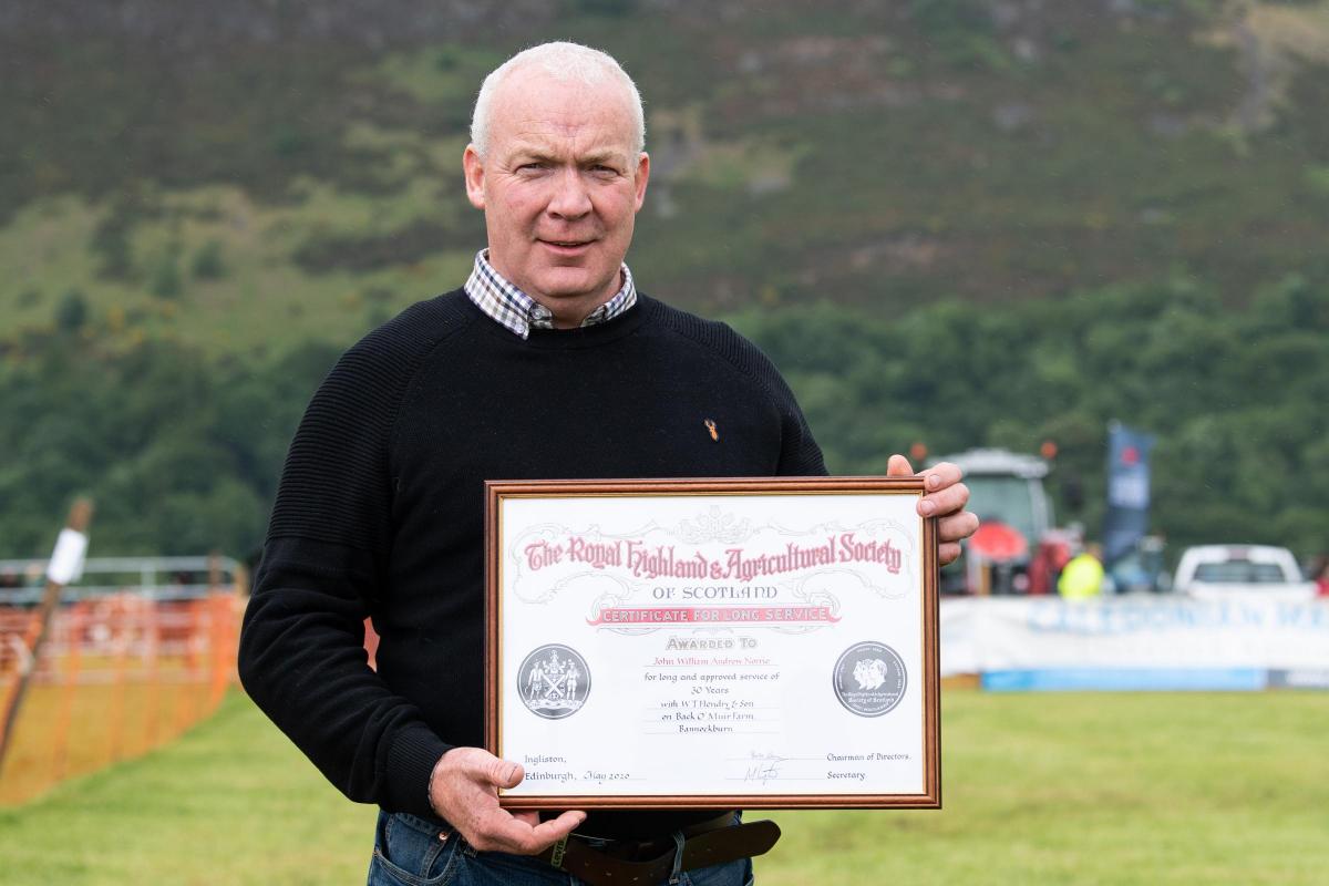John Norrie and his long service award, for 32 years at W T Hendry and  Son at Back O' Muir farm Bannockburn  Ref:RH110622214  Rob Haining / The Scottish Farmer...