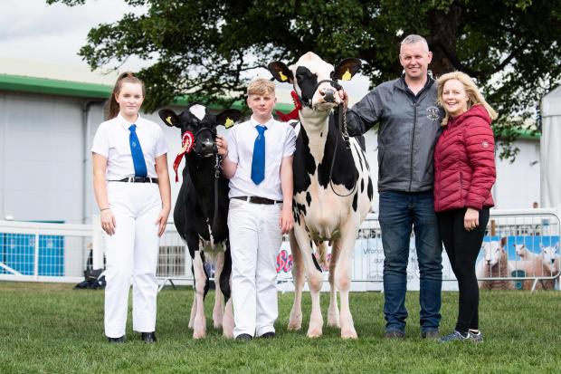 The Gray family from left: Erica, Callum, David and Julie with this year's junior champion at the Royal Highland Show and a first place calf Ref:RH260622033