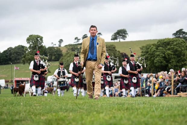 The Scottish Farmer: Biggar Show President, Jack Wight leads the way during the parade Ref:RH230722050 Rob Haining / The Scottish Farmer...