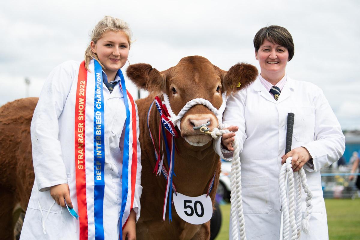 Amy and Liz Vance after winning the overall cattle championship with their Commercial champion  Ref:RH270722056  Rob Haining / The Scottish Farmer...
