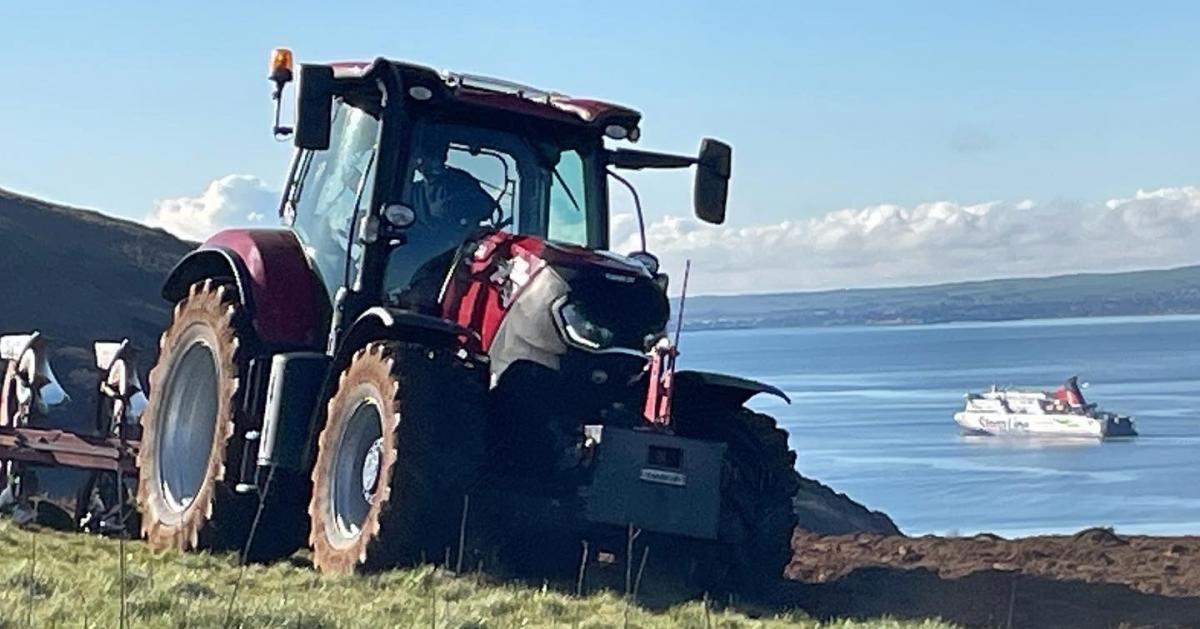 Charles Russell - Martin Greenhill of contractors Wm Hyslop and Sons ploughing the cliff tops above the mouth of Loch Ryan at Glenapp for Spring Barley