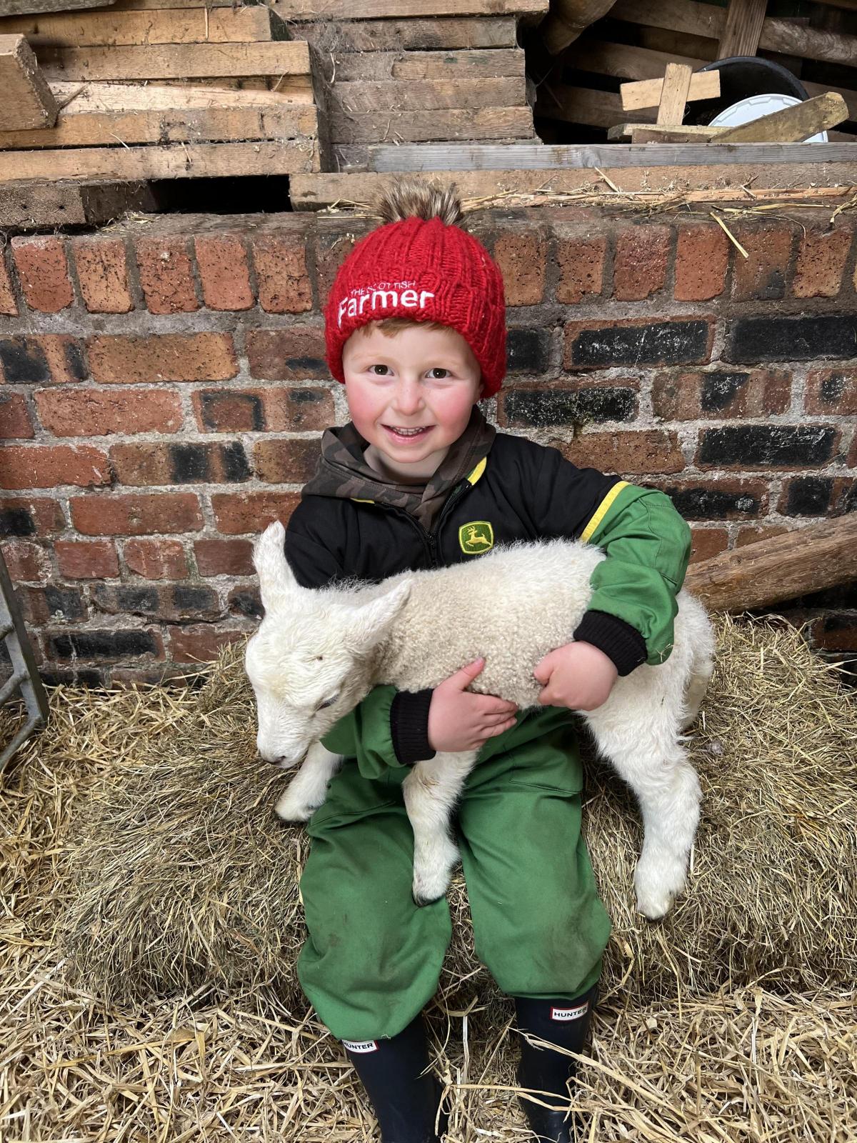Laura Barrowman - Kyle Chrisp Age 5 with pet lambs