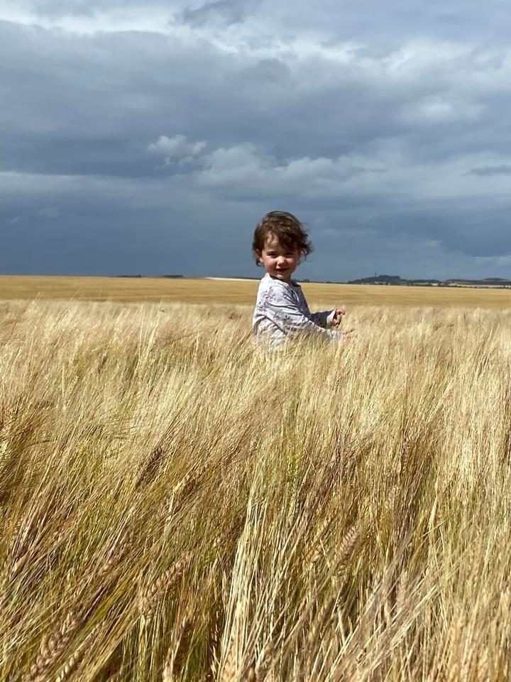 Marion Steven - Annabelle Steven checking the Spring barley with her dad at Kirklands Farm, Haddington, East Lothian