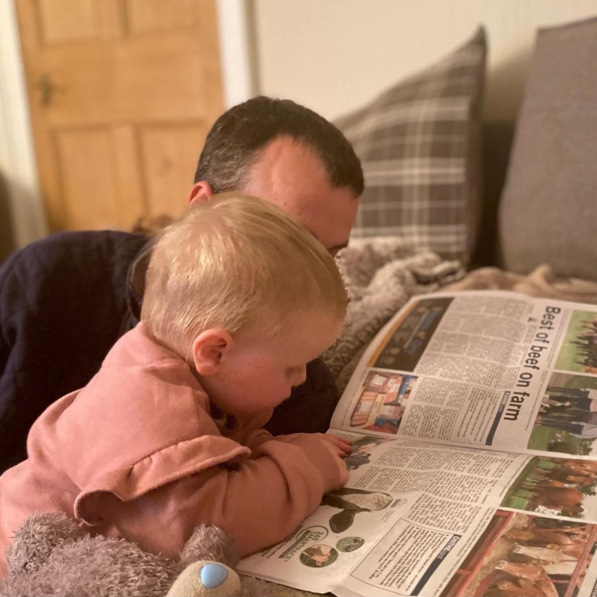 Samantha Howatson - Erin Reid getting caught up on the weekly news in the Scottish Farmer with her dad