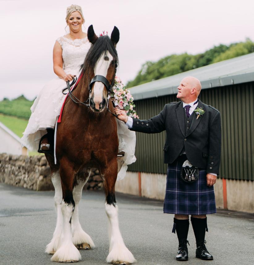 Heather Steel - My wedding day 22-07-22 on my Clydesdale Bruno with my heels and bouquet. Dad Jim Steel said this was the only time he will look up to me. Picture