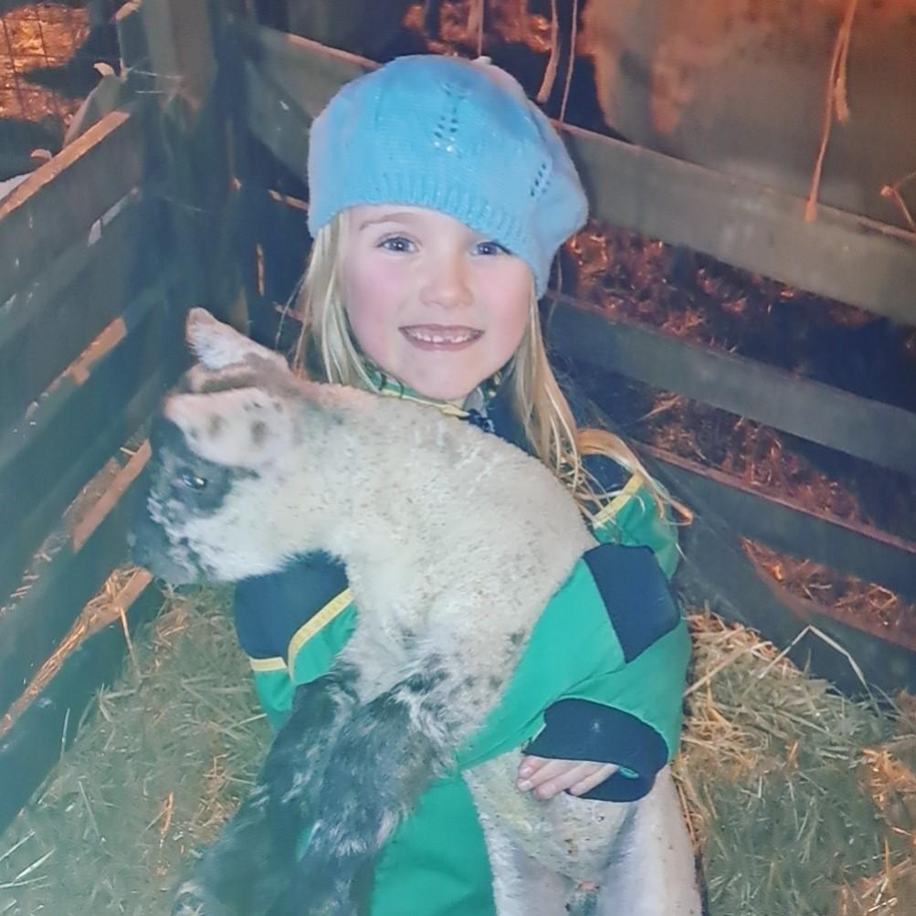 Suzie Brown - Millie with the first pet lamb for the year Cutiepie